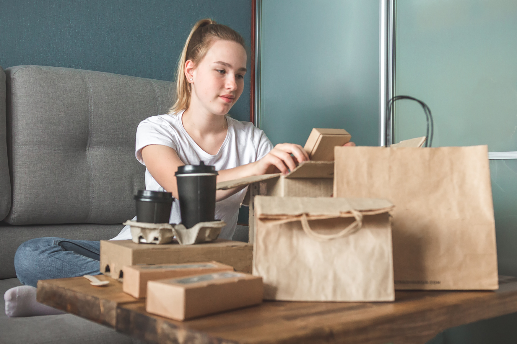 Woman with paper packaging. Paper Packaging Answers Demand for Plastic Alternatives