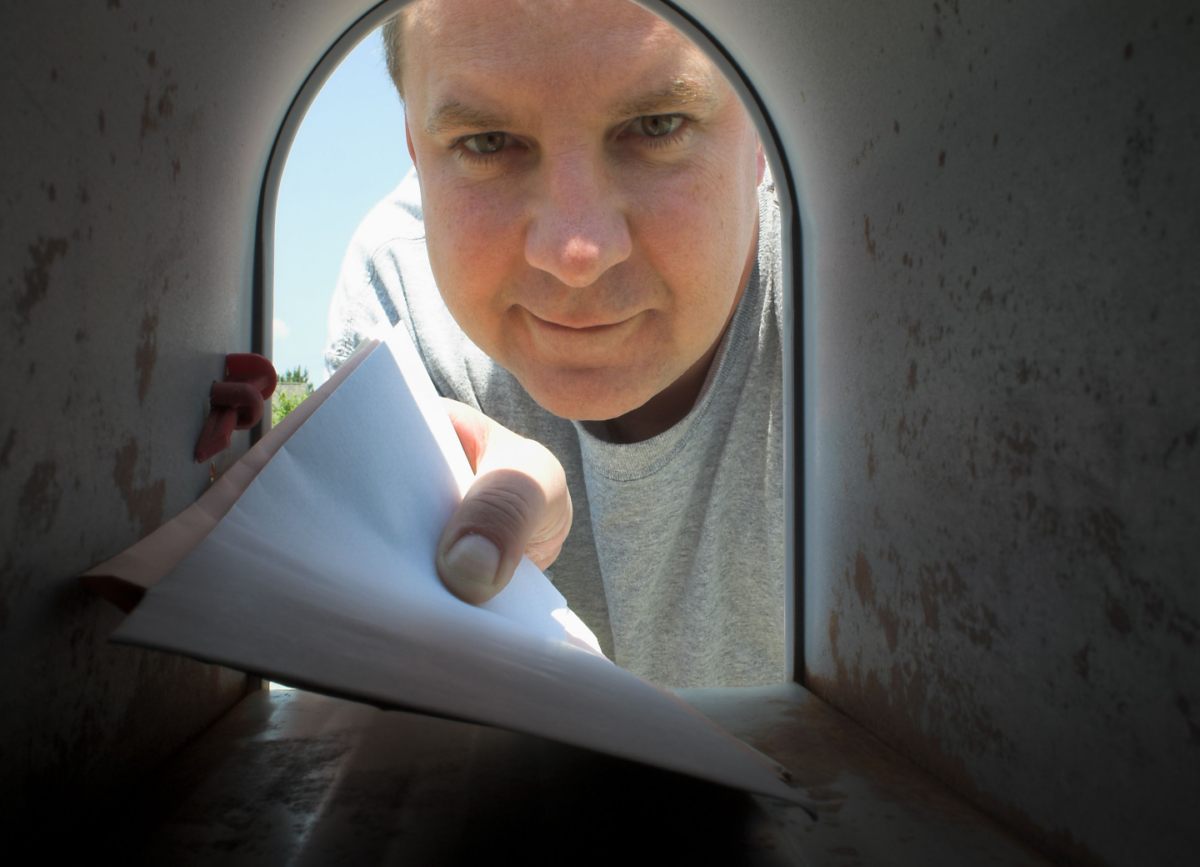 Domtar has joined Keep US Posted to advocate for reliable, affordable postal service. Image: Man reaching into mailbox for stack of mail.