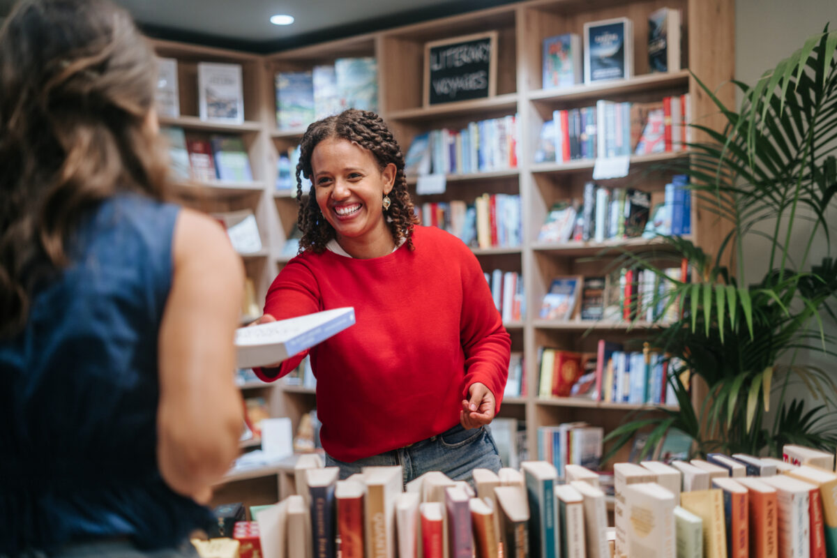 Woman buying books at store