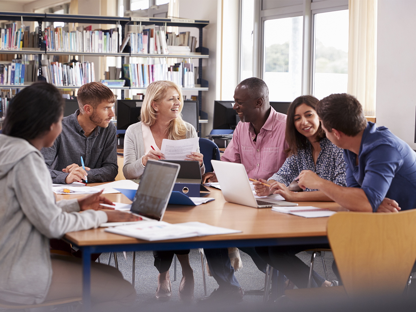 Image: Group of adults in a study group at a library. Domtar offers tuition assistance to support employees' educational goals. Find out more.