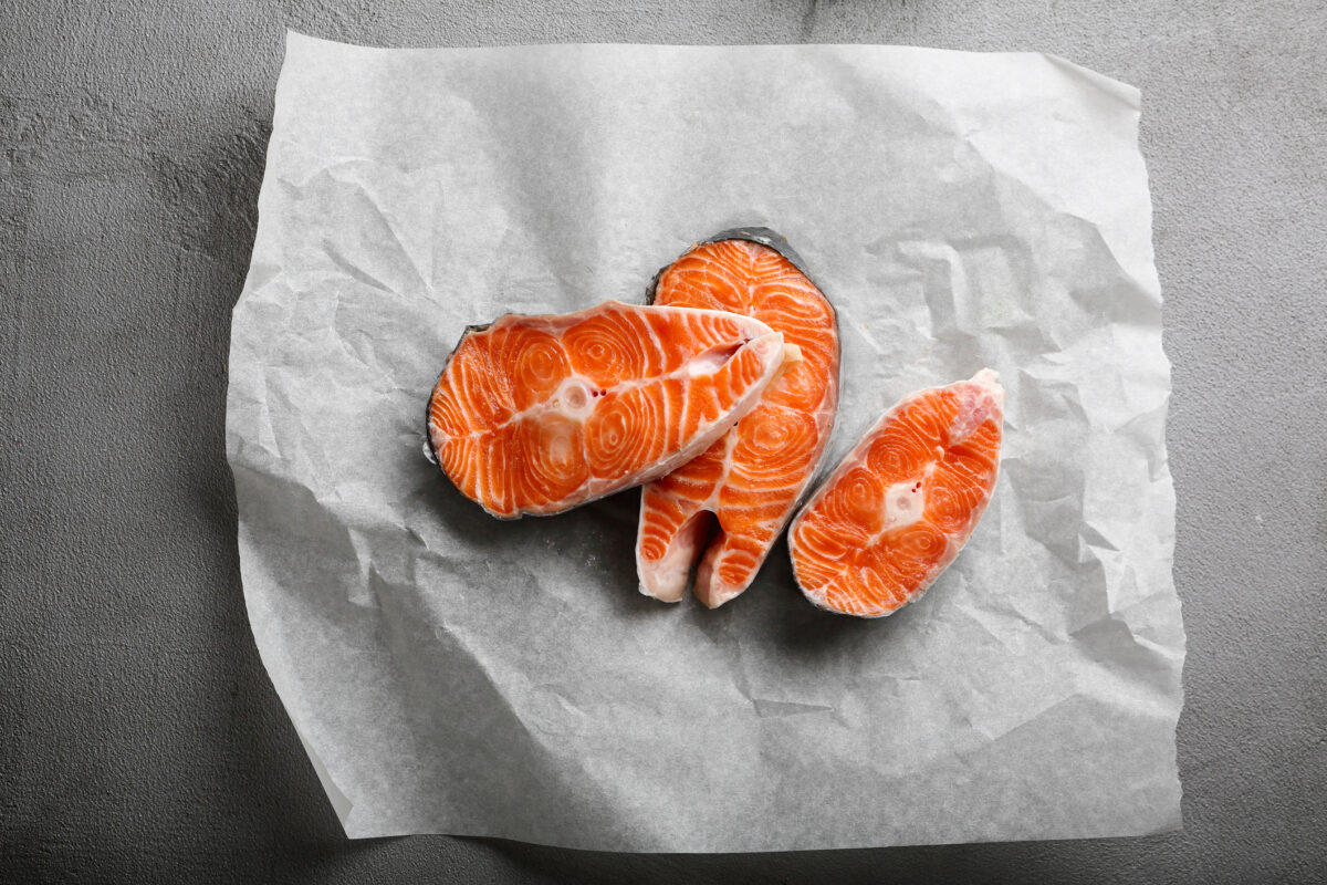 Raw salmon red fish steaks, food above