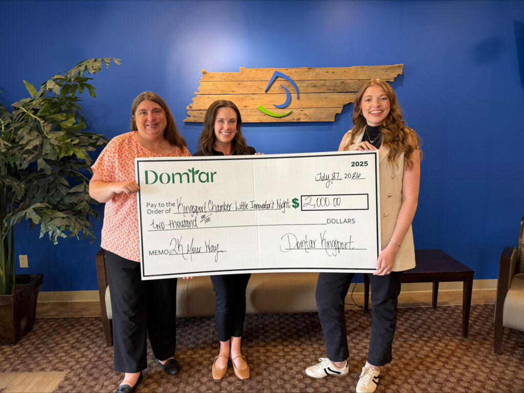 Domtar's Ellie Mitchell (right) presents a $2K Your Way grant to representatives of the Kingsport Chamber's Education & Workforce Development program.