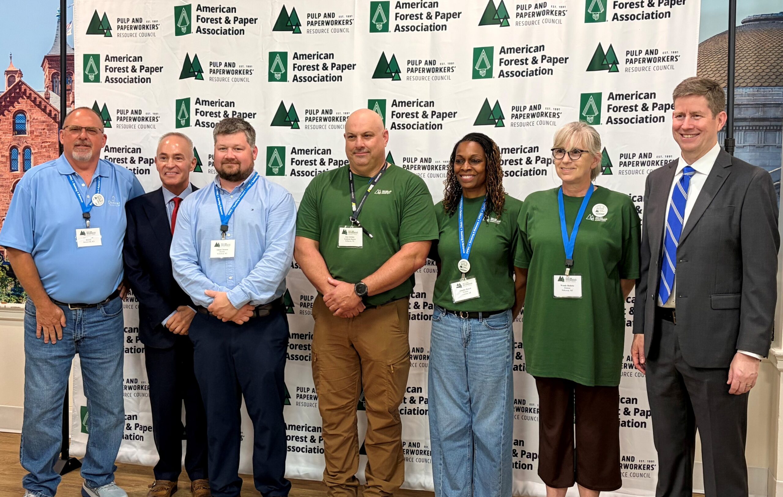 Seven Domtar employees photographed in front of the AF&PA/Pulp & Paperworkers' Resource Council logo background on an industry advocacy day in June 2026.