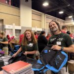 Domtar employees from Fort Mill, SC, packing backpacks.