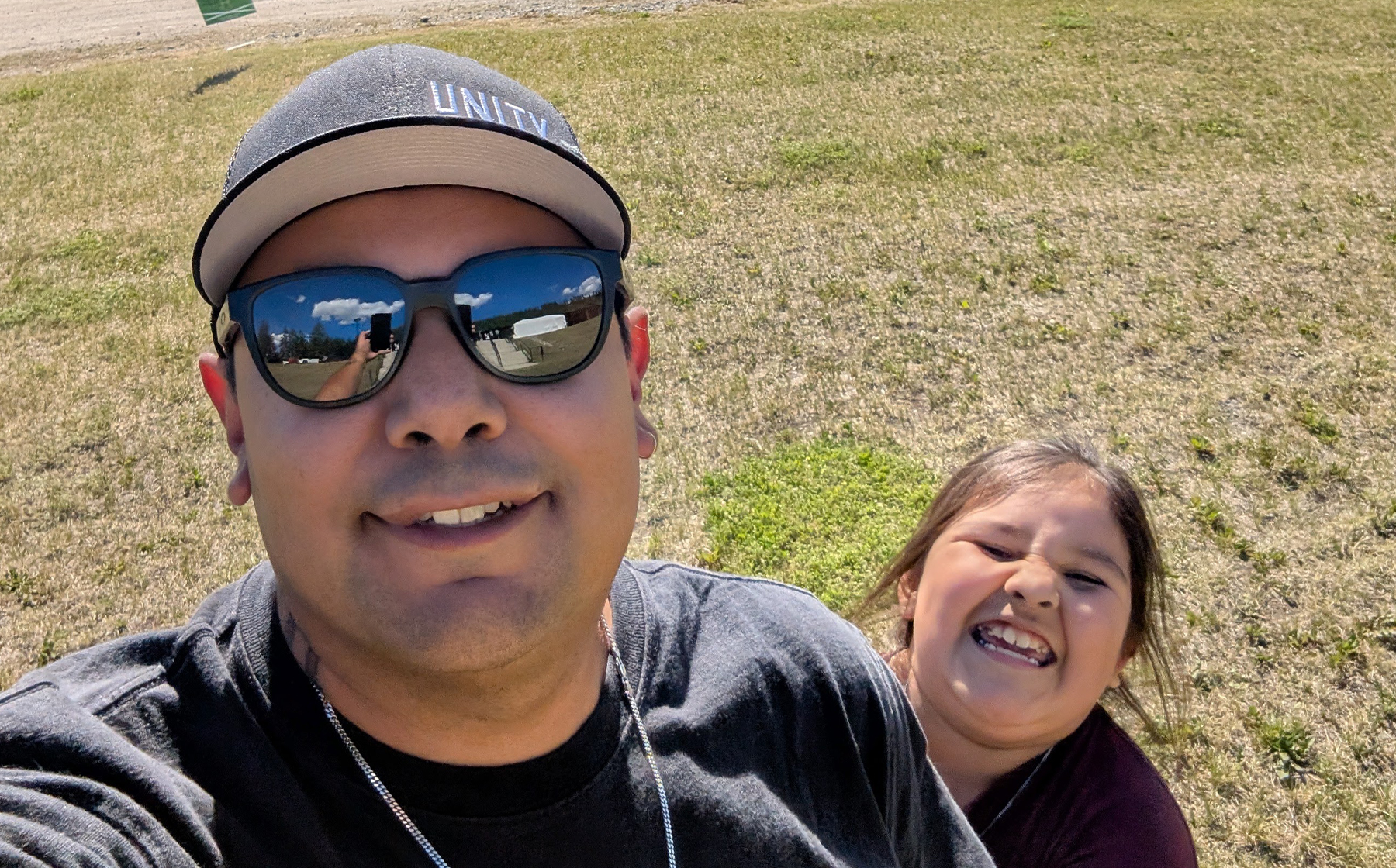 A selfie of a man, Colten Wycotte, with his daughter. Colten received a Building Brighter Futures scholarship from Indspire, funded by Domtar.